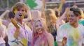 Best friends enjoying concert, dancing like crazy at Holi festival, happy crowd HD Footage