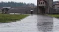 Best friends walking in the rain in the architectural complex. Rainy autumn HD Footage