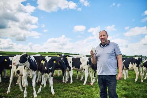 The best milk on the market, guaranteed. Cropped portrait of a male farmer Stock Photos
