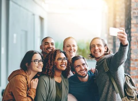 The best study buddies you could want. Portrait of a group of happy young Stock Photos
