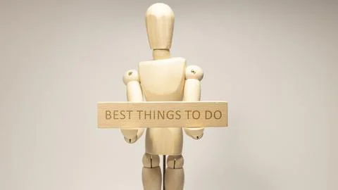 Best things to do was written on the wooden surface. Wooden Concept Stock Photos