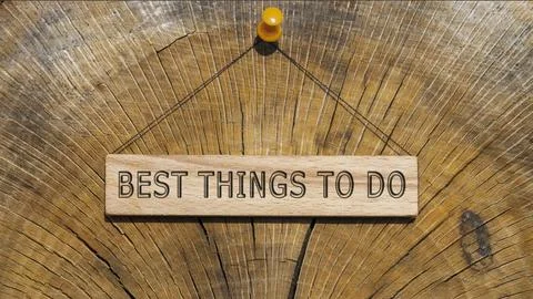 Best things to do was written on the wooden surface. Wooden Concept Stock Photos