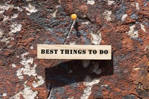 Best things to do was written on the wooden surface. Wooden Concept Stock Photos