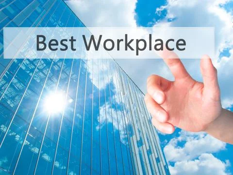 Best Workplace - Hand pressing a button on blurred background concept on visu Stock Photos