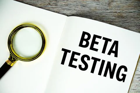 Beta Testing text written on chalkboard with alarm clock on wooden background Stock Photos