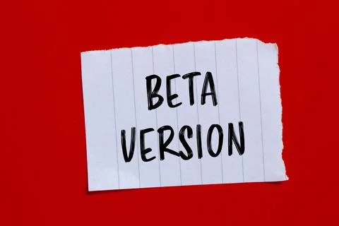 Beta version words written on ripped paper with red background. Conceptual be 스톡 사진