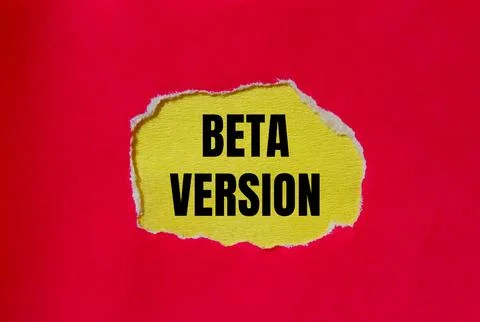 Beta version words written on ripped red paper with yellow background. Concep Stock Photos