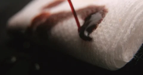 Betadin compress macro slow motion, studio shot in 4K prores HQ Stock-Footage 126366977