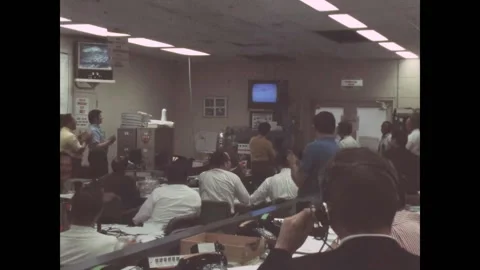 BETHPAGE - 1970 - Technicians watch the TV monitor during shot deployment at Video stock 327748133