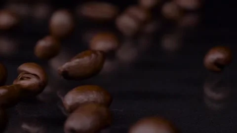 Better beans. Slow motion shot of fresh roasted brown coffee beans rolling 스톡 동영상 147412143
