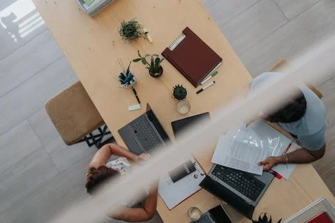 Better Efficiency in Business Development: High Angle View of Multiracial Stock Photos