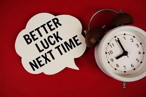 Better Luck Next Time text on speech bubble with alarm clock on red backgroun Stock Photos