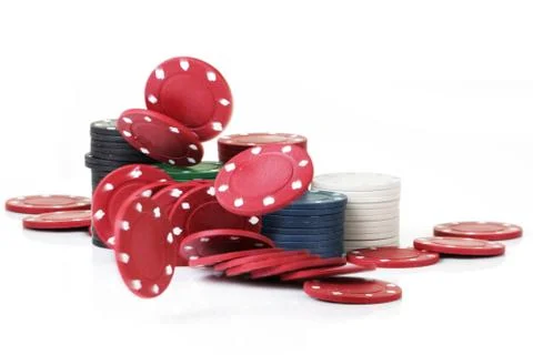 Betting chips dropping onto white surface with blurred motion Stock Photos