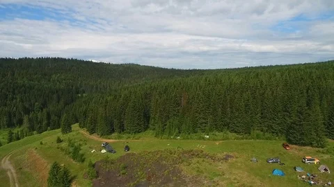 Between  blue sky and tops of  coniferous forest aerial view Vidéo 74322337