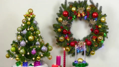 Between the Christmas tree and the Christmas wreath burning candles Stock Footage 201002281
