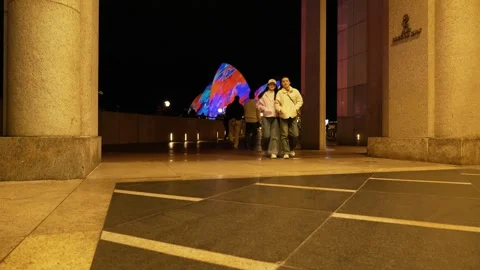 Between columns Sydney Opera House during VIVID 6K Stock Footage 311135699