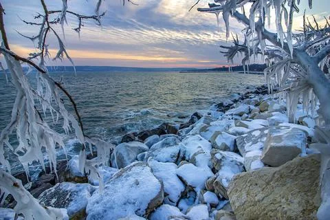 Between icicles Stock Photos
