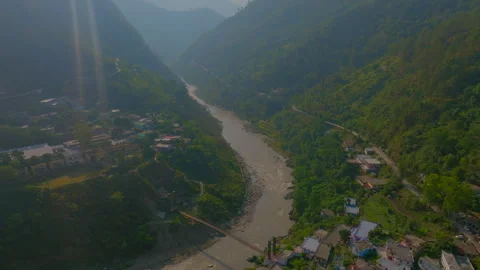 Between the mountain  river flowing shot at sunrise time Stock Footage 278351743