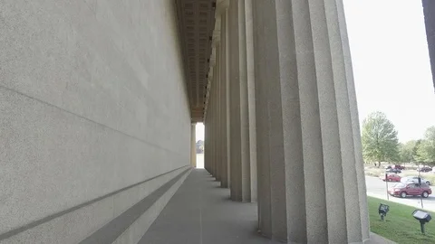 In between the pillars of The Parthenon in Nashville Stock Footage 85636729