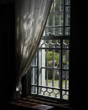 Between Silence and Hope - Light and Shadow in Traditional Windows Stock Photos