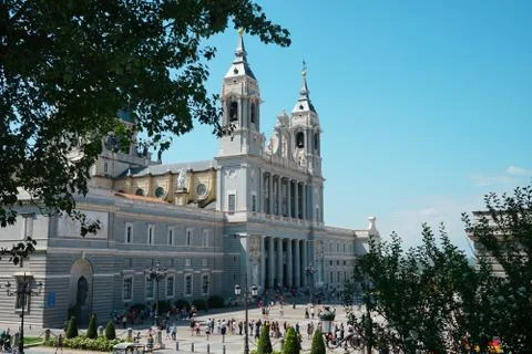 Between the trees view of the Almudena Cathedral, Madrid Spain Stock Photos