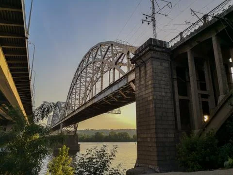 Between two big bridges on the left bank of the Dnipro river in Kyiv, Ukraine Stock Photos