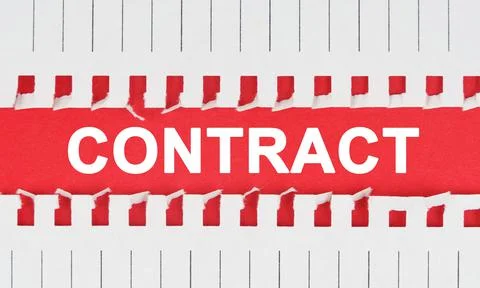 Between two sheets of notebook on a red background the inscription - CONTRACT Stock Photos