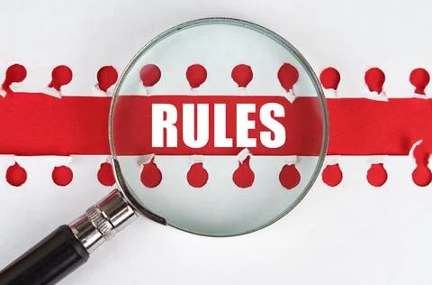 Between two sheets from a notebook on a red stripe with the inscription - RUL 스톡 사진