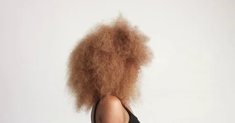 Beuayt black woman with a huge afro hair having fun smiling and touching her Stock Footage