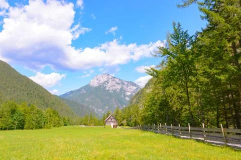 A beutiful landscape in the mountains, clouds above peaks and forest in Stock Photos