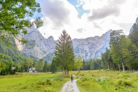 A beutiful landscape in the mountains, clouds above peaks and forest in Stock Photos