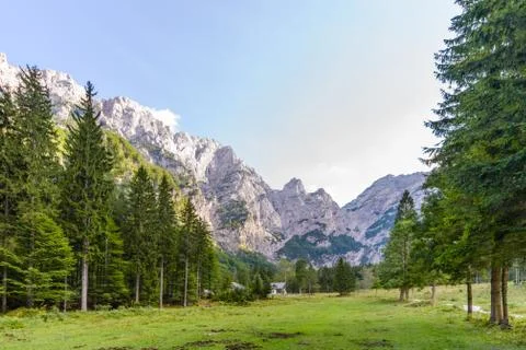 A beutiful landscape in the mountains, clouds above peaks and forest in Stock Photos