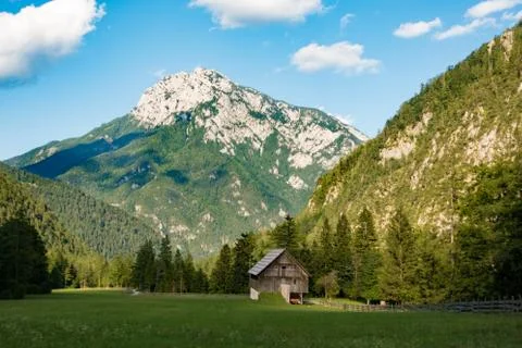 A beutiful landscape in the mountains, clouds above peaks and forest in Stock Photos