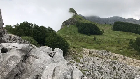 In a beutiful mountain location wind move clouds approaching rain Stock Footage 90780628