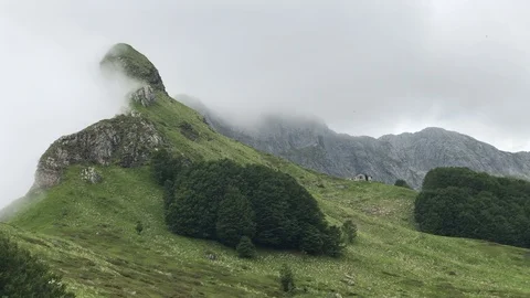 In a beutiful mountain location wind move clouds approaching rain Stock Footage 90780634
