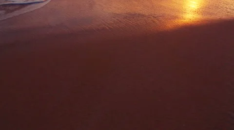 Beutiful Sandy Beach Sunset. Revealing Pan up from Sand to Sunset Stock Footage 56024774