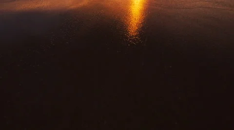 Beutiful Sandy Beach Sunset. Revealing Pan up from Sand to Sunset Stock Footage 56024801