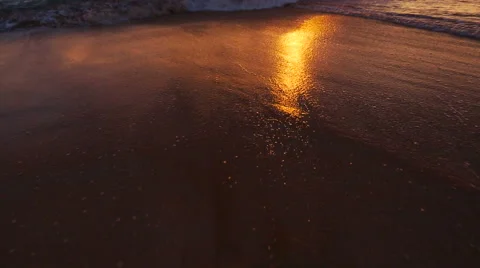 Beutiful Sandy Beach Sunset. Revealing Pan up from Sand to Sunset Stock Footage 56024847