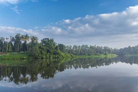 A beutiful scenery of landscape with river, sky in village in kerala, india Stock Photos