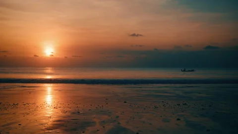 Beutiful sunset on the beach with a little bot in Bali Stock Footage 139812698