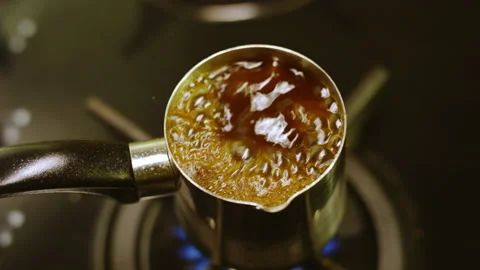 Beverage in coffeemaker boils signaling about readiness Stock Footage 229724517