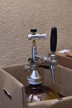 Beverage Dispenser in a Cardboard Box Setup Stock Photos