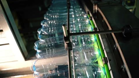 Beverage factory interior. Conveyor with plastic bottles Video stock 149673170