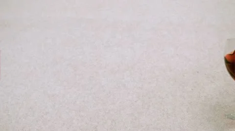 Beverage falling in super slow motion on carpet Stockbeeldmateriaal 11420615