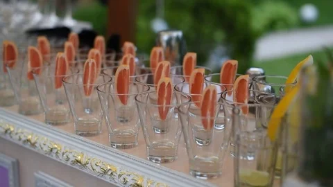 Beverage glasses with grapefruit wedges Stock Footage 76467877