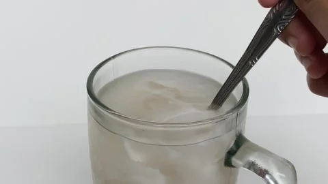 Beverage made from chilled or iced coconut water and young coconut flesh Video stock 293786395