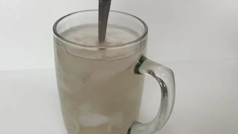 Beverage made from chilled or iced coconut water and young coconut flesh Stock Footage 293786483