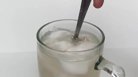 Beverage made from chilled or iced coconut water and young coconut flesh Stock Footage 293786533