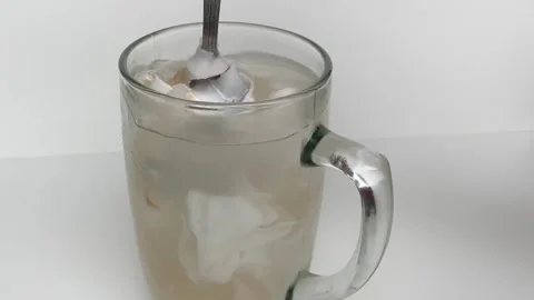 Beverage made from chilled or iced coconut water and young coconut flesh Stock Footage 293786670