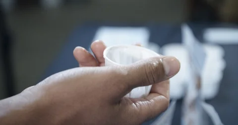 Beverage sample for customers at grocery store in small paper cup Stock-Footage 118848212